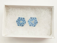 Load image into Gallery viewer, Two hexagon shaped earrings with intricate white, silver and blue patterns inside a white paper jewelry box.