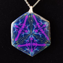 Load image into Gallery viewer, A large hexagonal pendant hanging from a silver chain and bail on a black velvet background. The pendant is navy blue with veins of gold around the edges and radiating from the center in thirds. There are purple veins in the relative shape of a triangle throughout the pendant.
