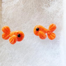 Load image into Gallery viewer, Two orange fish earrings made of polymer clay
