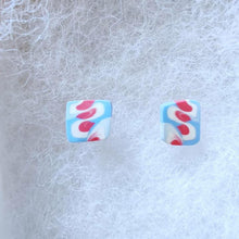 Load image into Gallery viewer, Two white, pink, and blue stud earrings
