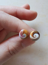 Load image into Gallery viewer, Purple, gold and white swirl earrings held between finger and thumb
