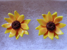 Load image into Gallery viewer, Close up of two sunflower earrings in a white paper jewelry box
