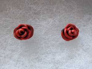 A pair of red and black rose flower earrings