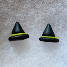Load image into Gallery viewer, A close up picture of a pair of black witches hats with yellow bands made into flat backed stud earrings. 
