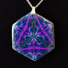 Load image into Gallery viewer, A large hexagonal pendant hanging from a silver chain and bail on a black velvet background. The pendant is navy blue with veins of gold around the edges and radiating from the center in thirds. There are purple veins in the relative shape of a triangle throughout the pendant. 
